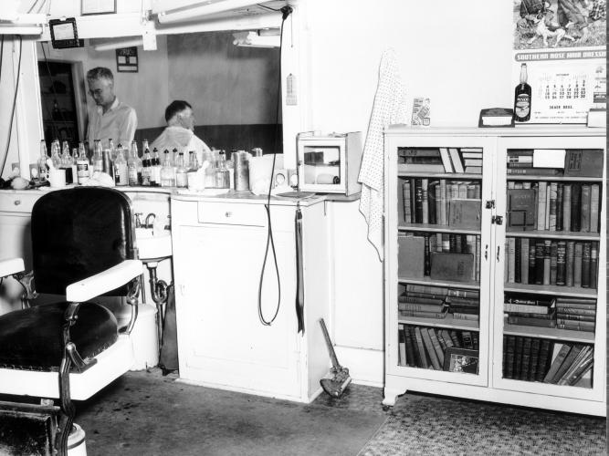 Self-Service Library in Spring Hill Barbershop A view of the self-service library inside a Spring Hill, Kansas barbershop circa 1954