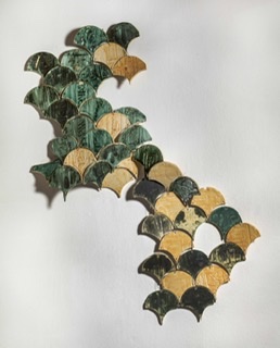 Shell shaped stoneware tiles in greens and neutral, wall hanging.