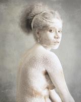 photograph of woman covered in white paint