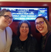 Three smiling Librarians at K-pop event 