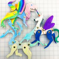 Colorful paper crafted puppets of mythical animals