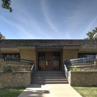 Corinth Library, which is single story building with stairs 